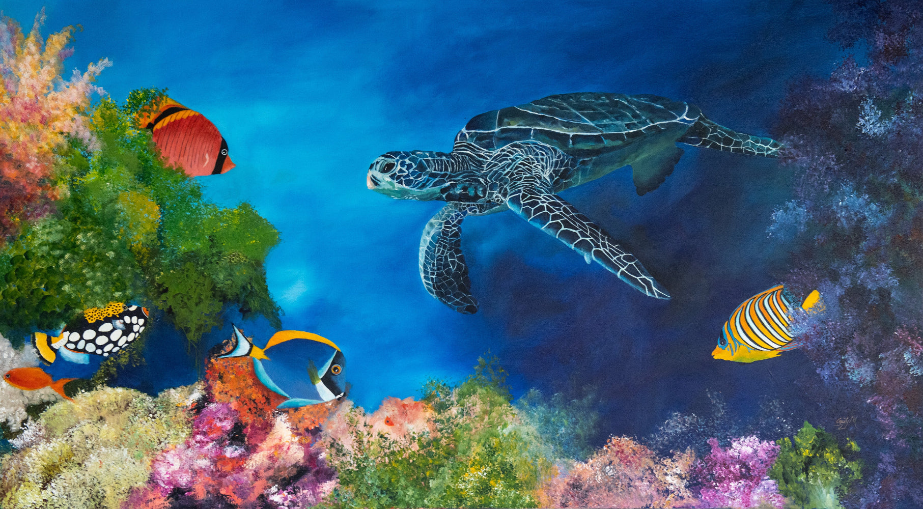 Tortoise swimming in a vibrant underwater scene with colorful fish and coral.