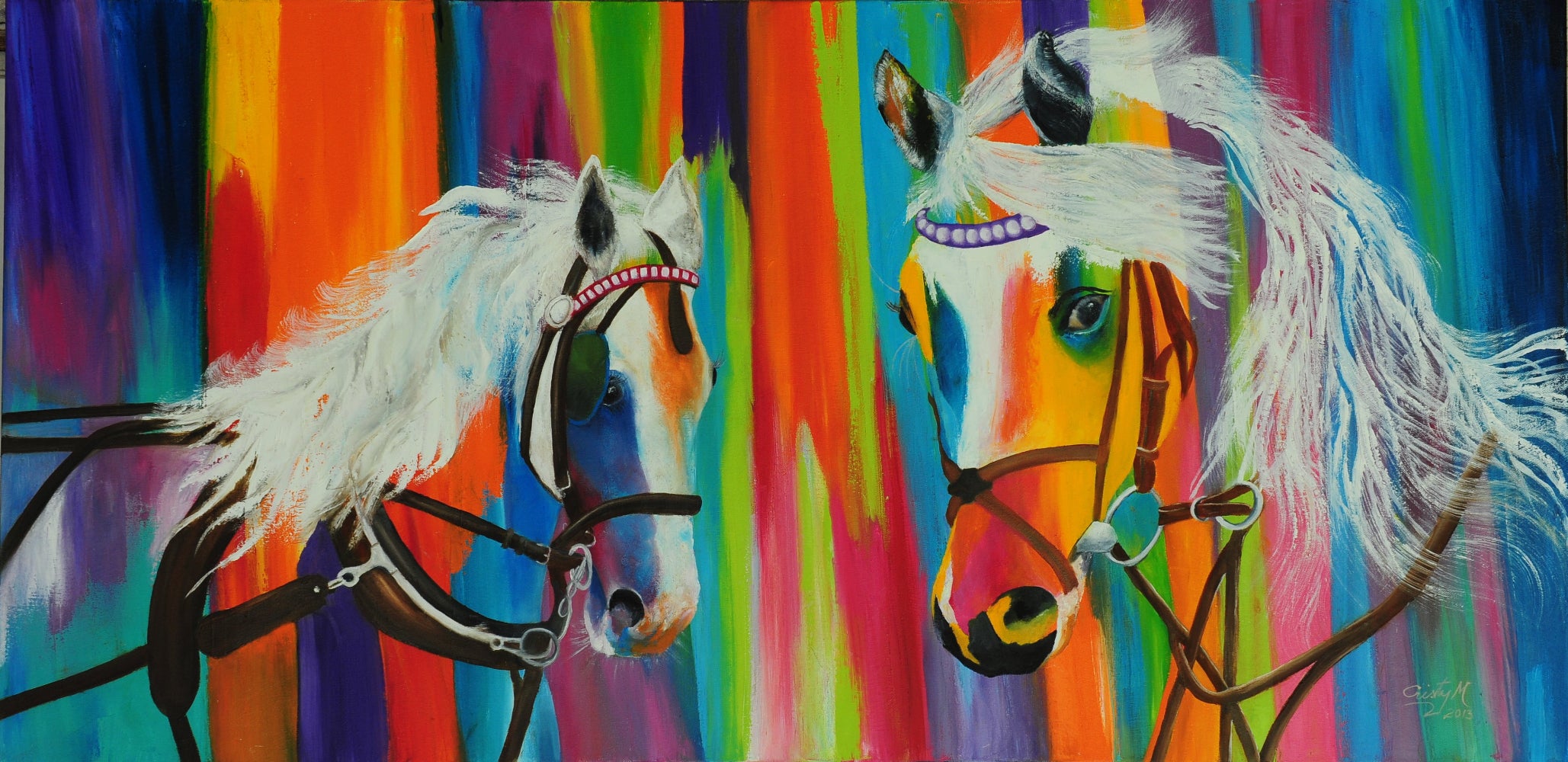 Two horses with colorful manes agains